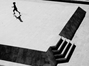 Boy running across an empty square in the old town of Jaffa/Tel Aviv